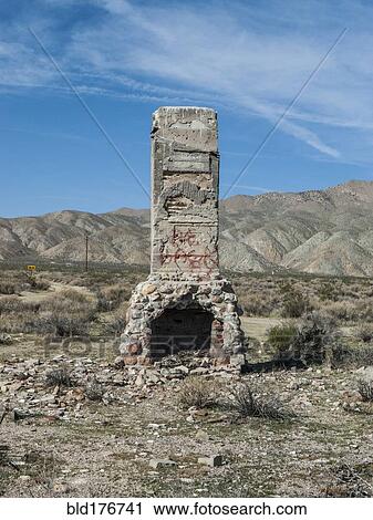 Stock Image - Fireplace of demolished house in remote landscape. Fotosearch