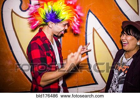 Friends laughing at mural outdoors View Large Photo Image Stock Photograph - Friends laughing at mural outdoors. Fotosearch