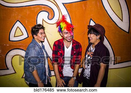 Stock Photography - Friends talking at mural outdoors. Fotosearch