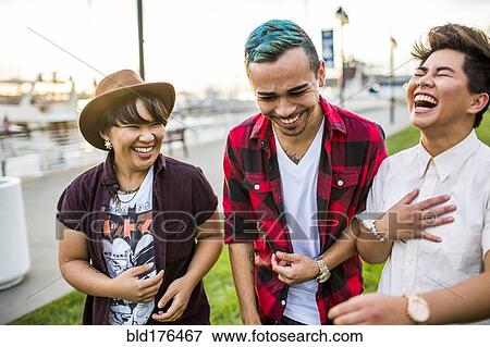 Stock Photo - Friends walking outdoors. Fotosearch