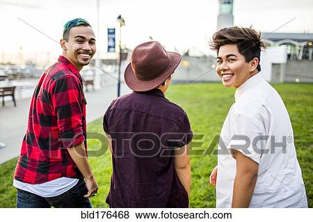 Stock Photo - Friends walking outdoors. Fotosearch