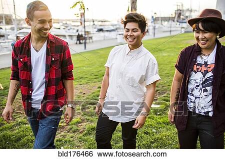 Stock Photograph - Friends walking outdoors. Fotosearch