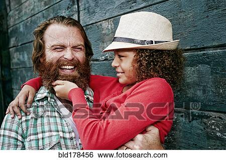Girl pulling beard of father View Large Photo Image Stock Photograph - Girl pulling beard of father. Fotosearch