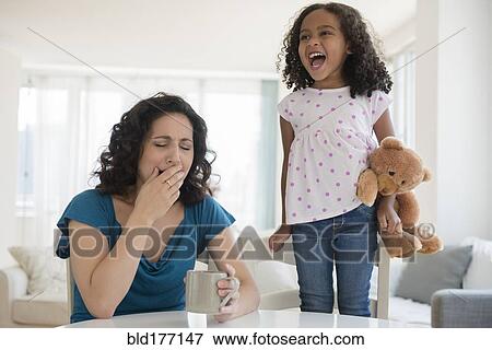 Stock Photo - Girl shouting at stressed mother. Fotosearch