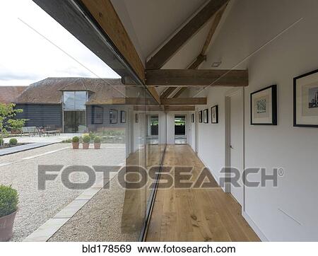 Glass wall and hallway of modern home View Large Photo Image Stock Photo - Glass wall and hallway of modern home. Fotosearch