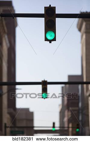 Green lights over city street View Large Photo Image Stock Image - Green lights over city street. Fotosearch
