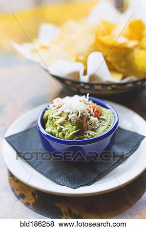 Stock Photo - Guacamole and tortilla chips. Fotosearch