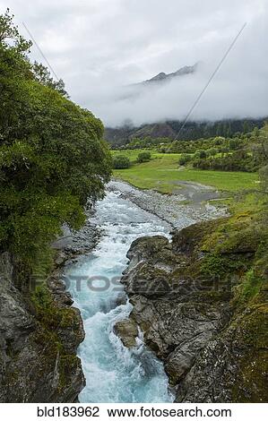 Stock Image - High angle view of river in remote landscape. Fotosearch