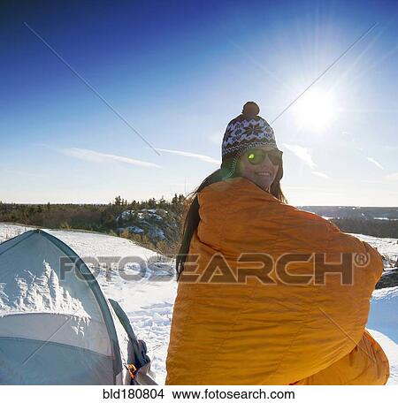 Hiker standing at snowy campsite View Large Photo Image Picture - Hiker standing at snowy campsite. Fotosearch