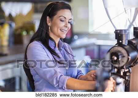 Hispanic barista making coffee in cafe View Large Photo Image Stock Photography - Hispanic barista making coffee in cafe. Fotosearch