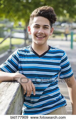 Hispanic boy smiling outdoors View Large Photo Image Stock Photo - Hispanic boy smiling outdoors. Fotosearch