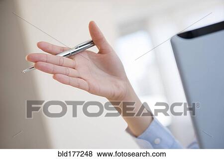 Hispanic businesswoman gesturing in office View Large Photo Image Stock Photo - Hispanic businesswoman gesturing in office. Fotosearch