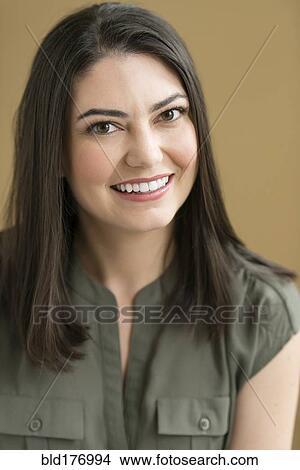 Picture - Hispanic businesswoman smiling. Fotosearch