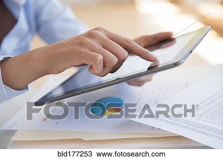Hispanic businesswoman using digital tablet View Large Photo Image Stock Image - Hispanic businesswoman using digital tablet. Fotosearch