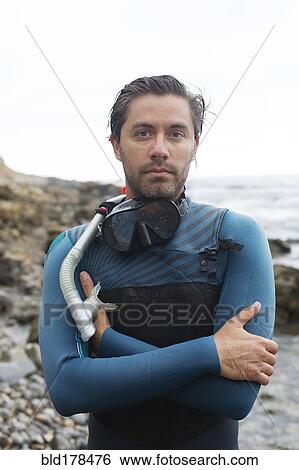 Stock Photograph - Hispanic diver wearing snorkel mask. Fotosearch