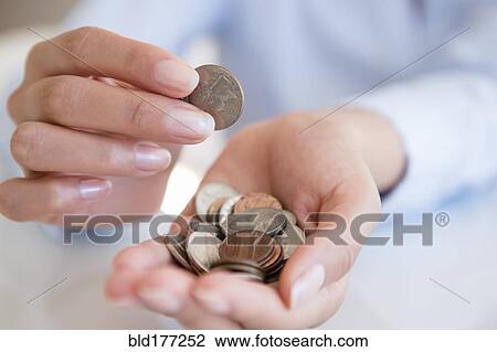 Hispanic woman counting coins View Large Photo Image Stock Image - Hispanic woman counting coins. Fotosearch