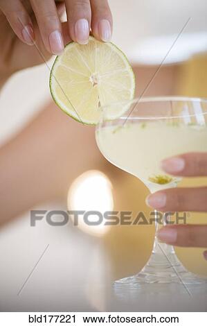 Hispanic woman drinking cocktail View Large Photo Image Stock Image - Hispanic woman drinking cocktail. Fotosearch