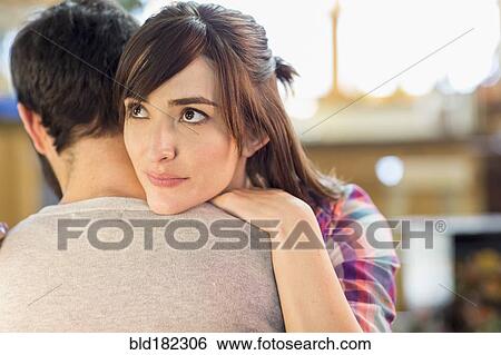 Hispanic woman hugging boyfriend View Large Photo Image Stock Photograph - Hispanic woman hugging boyfriend. Fotosearch