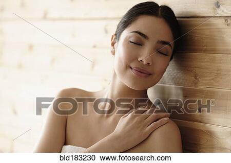 Hispanic woman relaxing in sauna View Large Photo Image Stock Image - Hispanic woman relaxing in sauna. Fotosearch