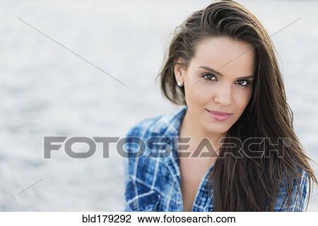 Hispanic woman smiling outdoors View Large Photo Image Stock Image - Hispanic woman smiling outdoors. Fotosearch