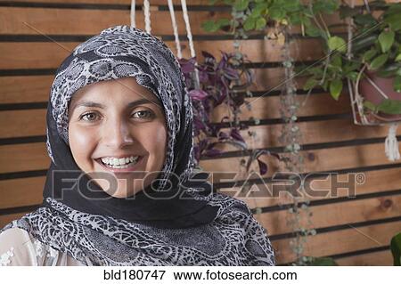 Stock Photo - Hispanic woman wearing headscarf. Fotosearch
