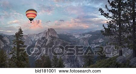 Stock Image - "Hot air balloon flying over Yosemite, California, United States". Fotosearch