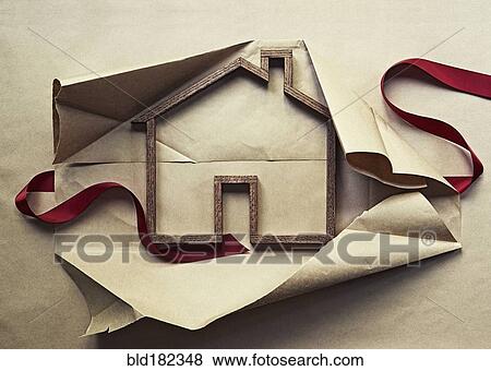 House shape in unwrapped gift View Large Photo Image Stock Photo - House shape in unwrapped gift. Fotosearch