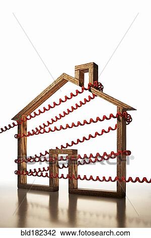 Stock Image - House shape wrapped in phone cord. Fotosearch