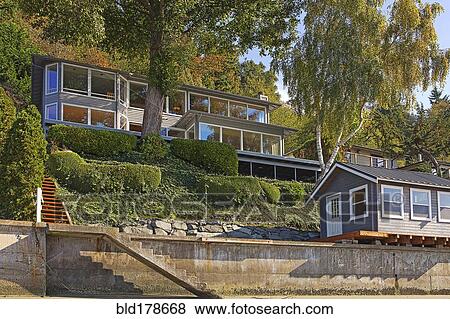 Stock Photo - Houses on hillside at waterfront. Fotosearch