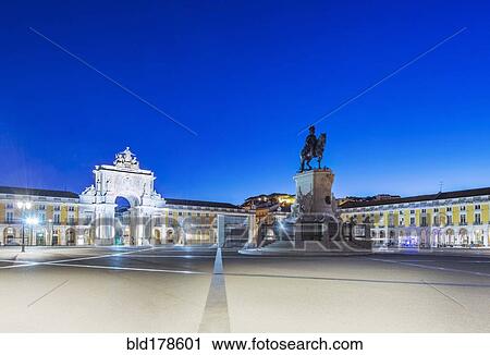 Stock Image - Illuminated fountain and ornate buildings in Commerce Square, Lisbon, Lisbon, Portugal. Fotosearch