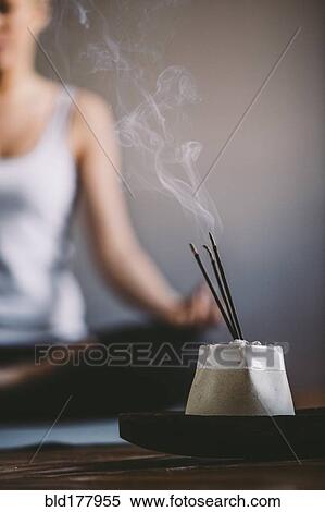 Stock Photography - Incense burning in yoga studio. Fotosearch