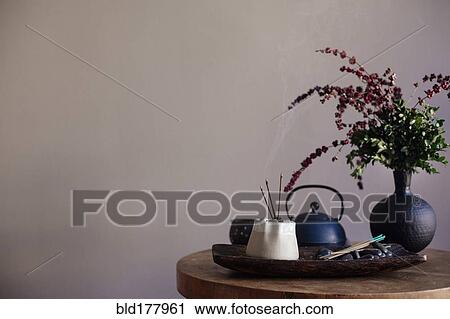 Stock Image - Incense burning on tea tray. Fotosearch