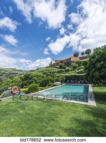 Stock Image - Infinity pool in rural hillside. Fotosearch