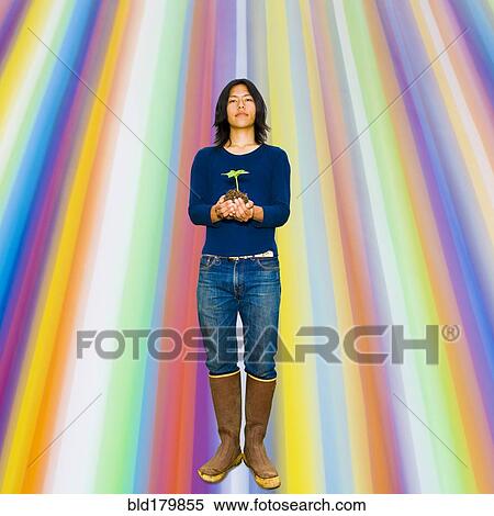 Japanese gardener holding plant View Large Photo Image Stock Photography - Japanese gardener holding plant. Fotosearch