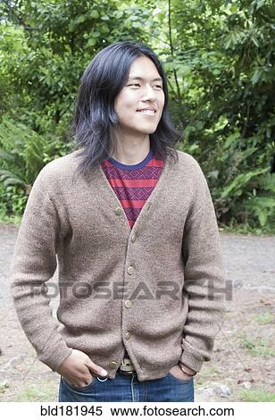 Japanese man standing outdoors View Large Photo Image Stock Photography - Japanese man standing outdoors. Fotosearch