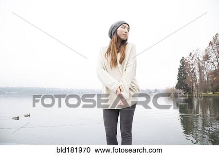 Japanese woman standing near lake View Large Photo Image Stock Image - Japanese woman standing near lake. Fotosearch