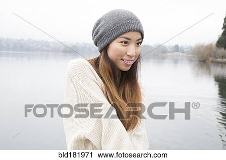Japanese woman standing near lake View Large Photo Image Stock Image - Japanese woman standing near lake. Fotosearch