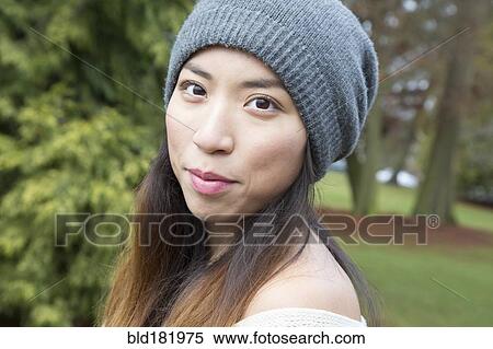 Japanese woman wearing beanie outdoors View Large Photo Image Stock Photography - Japanese woman wearing beanie outdoors. Fotosearch