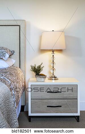 Lamp and bedside table in bedroom View Large Photo Image Stock Image - Lamp and bedside table in bedroom. Fotosearch
