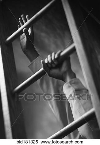 Stock Photography - Low angle view of hands climbing ladder. Fotosearch