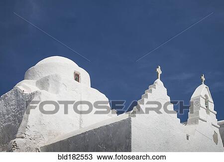 Stock Image - Low angle view of traditional building under blue sky. Fotosearch