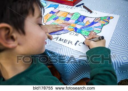 Mixed race boy coloring United States map View Large Photo Image Stock Photography - Mixed race boy coloring United States map. Fotosearch
