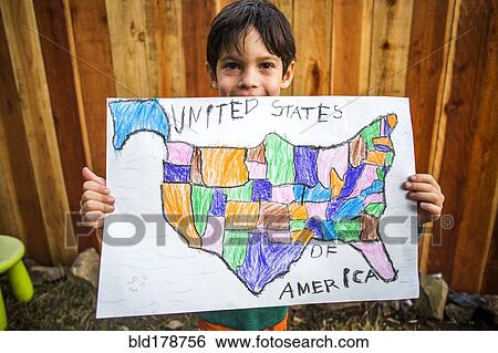 Mixed race boy holding United States map View Large Photo Image Stock Photograph - Mixed race boy holding United States map. Fotosearch