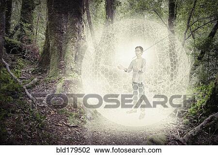 Mixed race boy in digital orb in forest View Large Photo Image Stock Image - Mixed race boy in digital orb in forest. Fotosearch