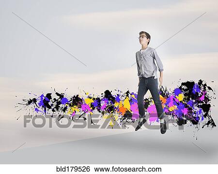 Mixed race boy jumping with paint splatters View Large Photo Image Stock Photograph - Mixed race boy jumping with paint splatters. Fotosearch
