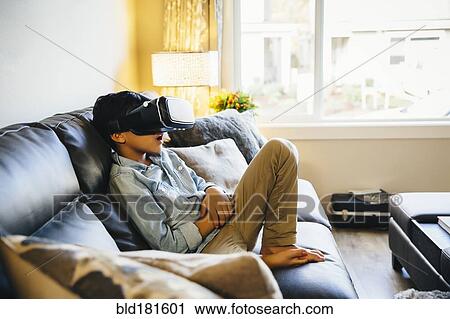 Mixed race boy using virtual reality goggles View Large Photo Image Stock Image - Mixed race boy using virtual reality goggles. Fotosearch