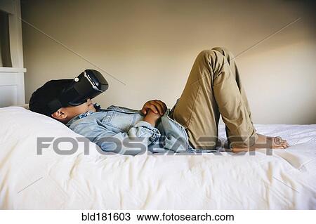 Mixed race boy using virtual reality goggles View Large Photo Image Stock Image - Mixed race boy using virtual reality goggles. Fotosearch