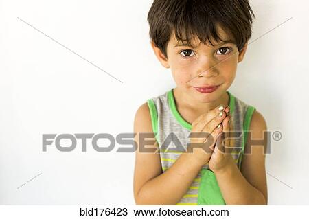 Stock Image - Mixed race boy wearing nail polish. Fotosearch