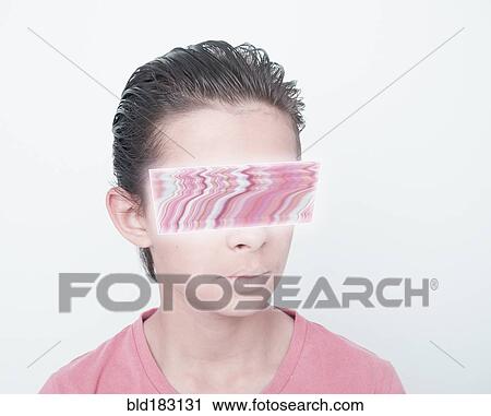 Stock Image - Mixed race boy with glitch covering eyes. Fotosearch