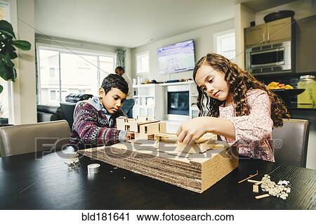 Mixed race children building model house View Large Photo Image Stock Image - Mixed race children building model house. Fotosearch
